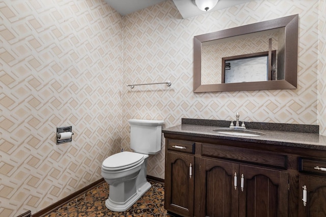 bathroom with toilet and vanity