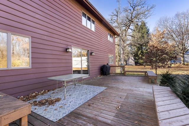 wooden deck featuring area for grilling