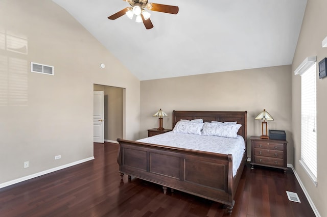 bedroom with ceiling fan, vaulted ceiling, and dark wood-type flooring