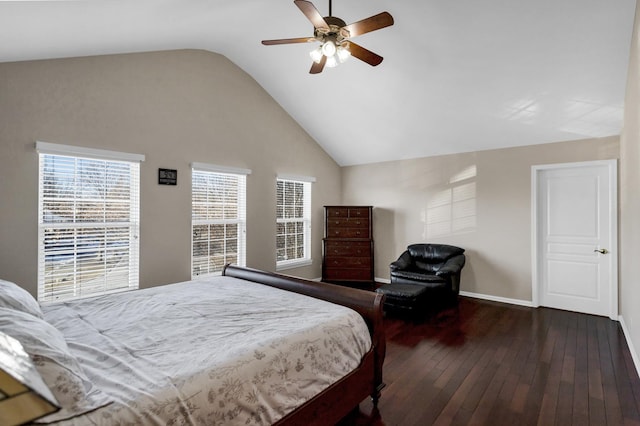 bedroom featuring dark wood-type flooring, vaulted ceiling, and ceiling fan