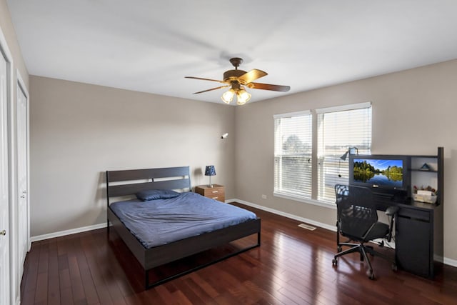 bedroom with a closet, ceiling fan, and dark hardwood / wood-style flooring