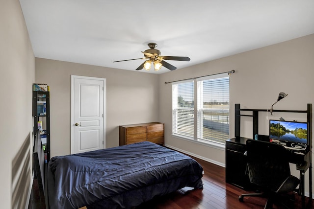 bedroom featuring ceiling fan and dark wood-type flooring