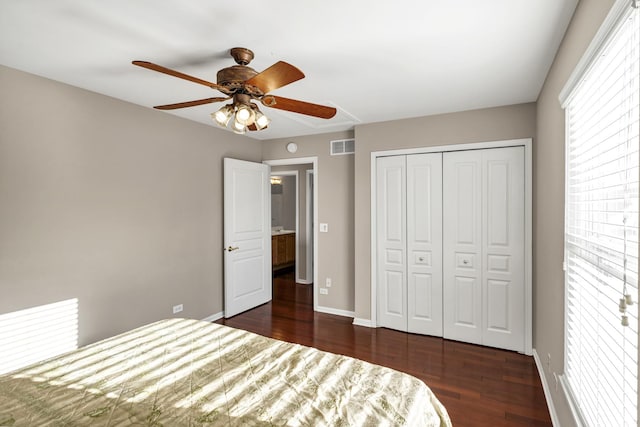 unfurnished bedroom featuring dark hardwood / wood-style floors, a closet, and ceiling fan