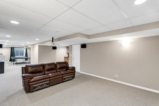 living room with carpet and a drop ceiling