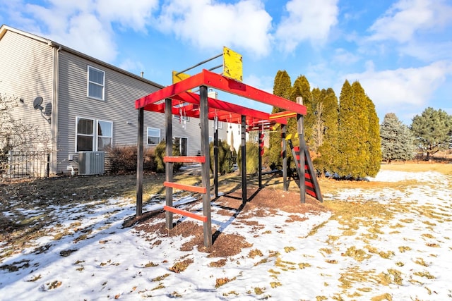 snow covered playground with central air condition unit