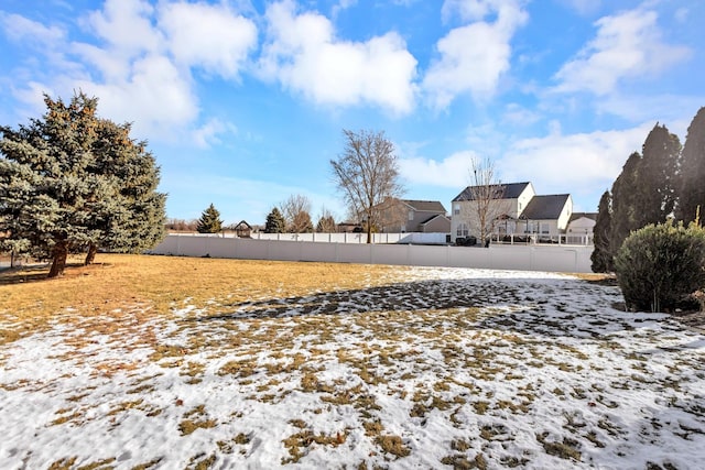 view of yard layered in snow