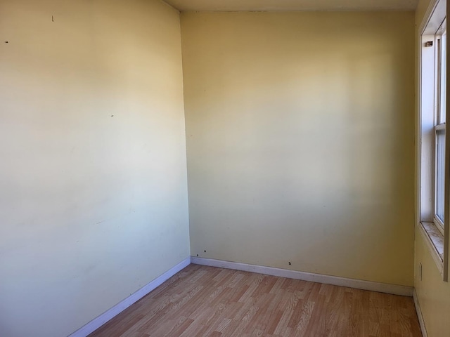 unfurnished room featuring light hardwood / wood-style flooring