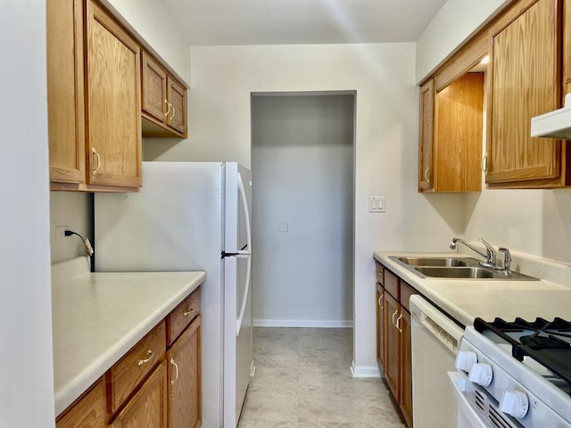 kitchen with sink and white appliances