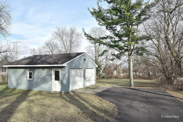 garage featuring a yard