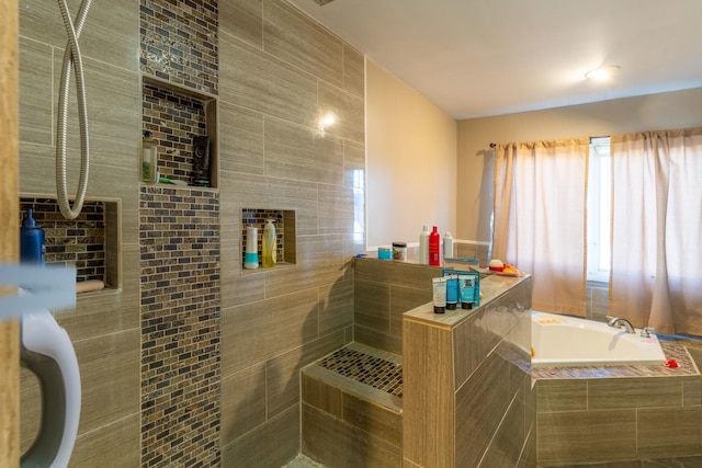 bathroom featuring a relaxing tiled tub