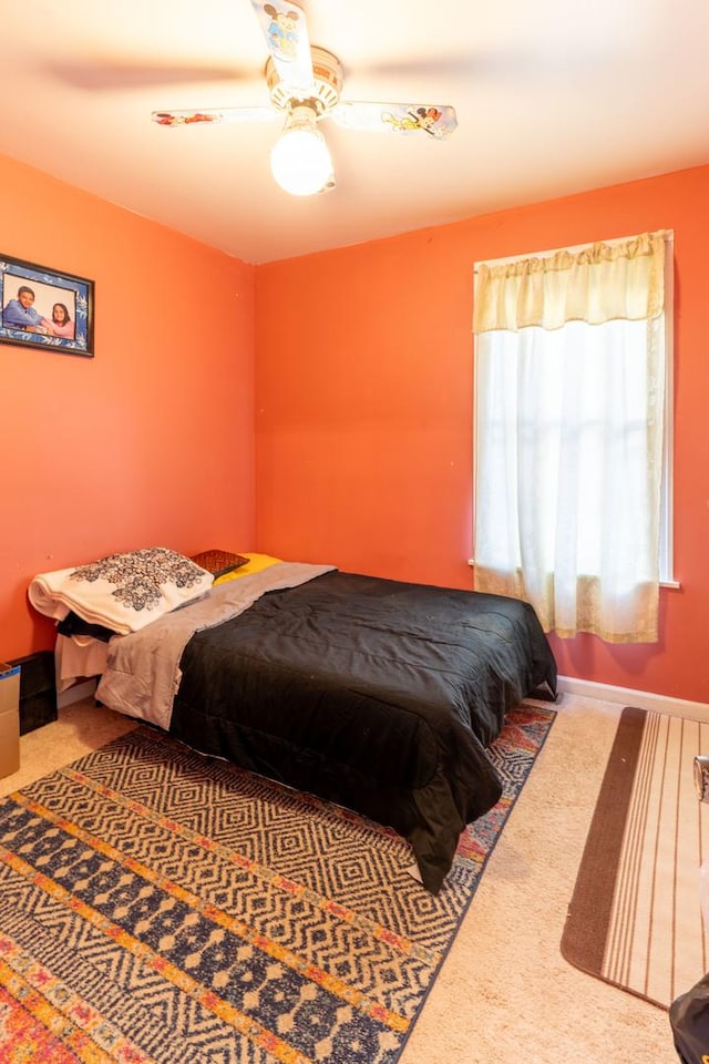 bedroom featuring ceiling fan and carpet floors