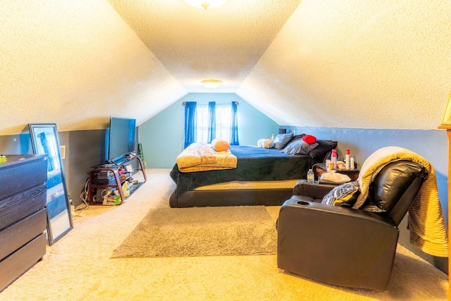 carpeted bedroom featuring a textured ceiling and lofted ceiling