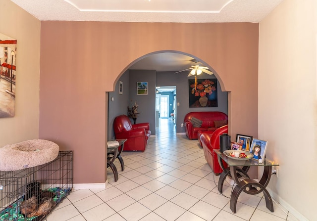 interior space featuring light tile patterned flooring and a textured ceiling