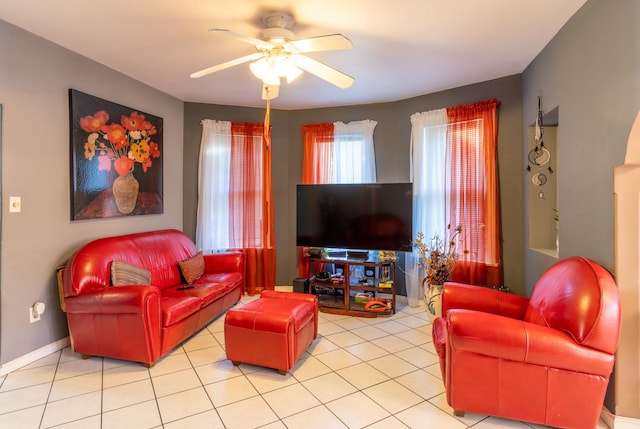 tiled living room with ceiling fan