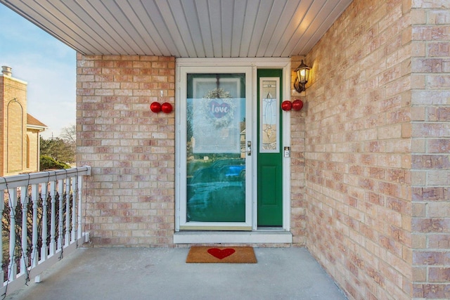 entrance to property with a balcony