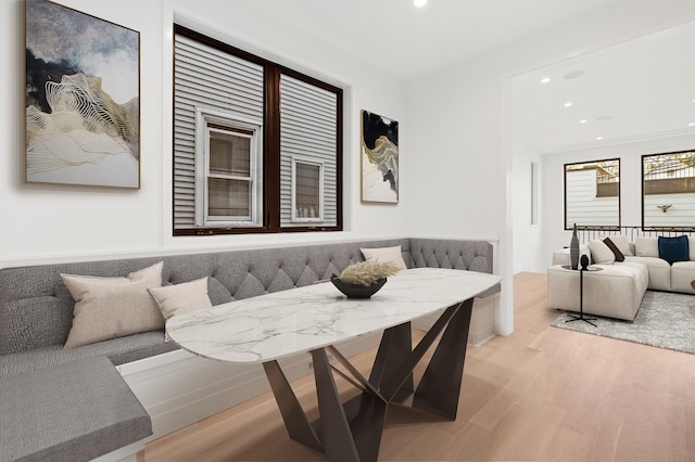 living room featuring light hardwood / wood-style flooring and breakfast area