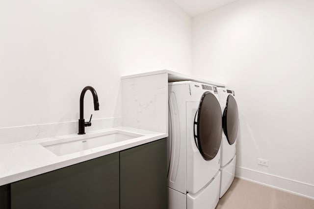 laundry room featuring sink and washer and clothes dryer