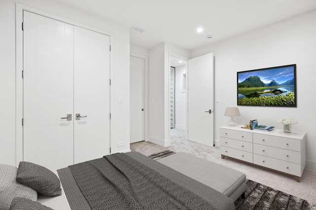 carpeted bedroom featuring a closet