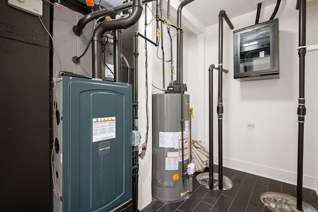 utility room with gas water heater