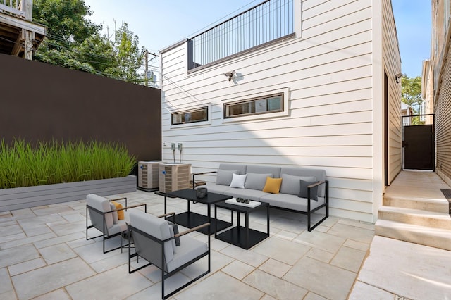 view of patio / terrace with central AC unit and outdoor lounge area