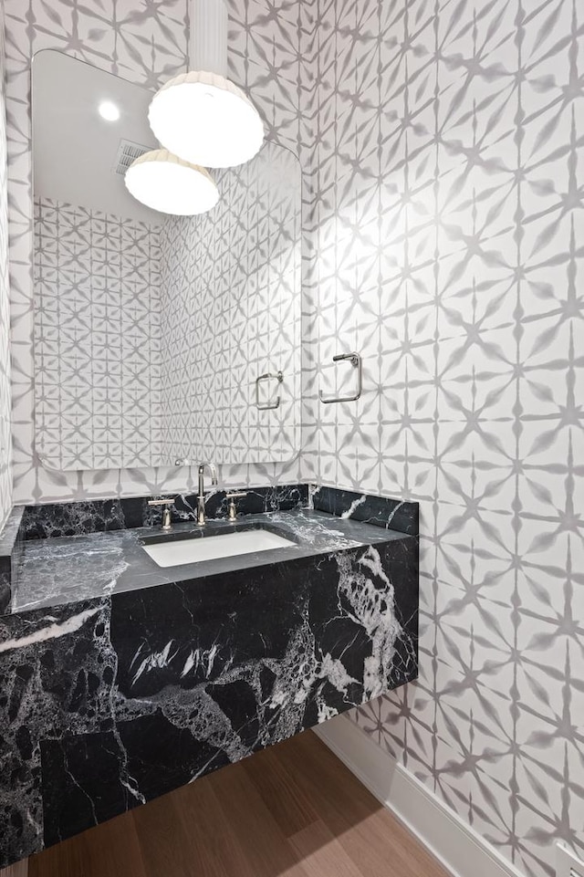 bathroom featuring hardwood / wood-style flooring and sink