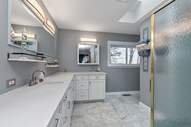 bathroom featuring vanity and a shower with shower door