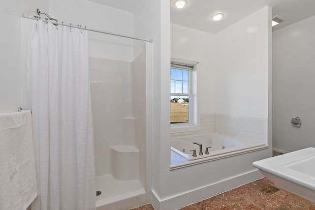 bathroom with separate shower and tub