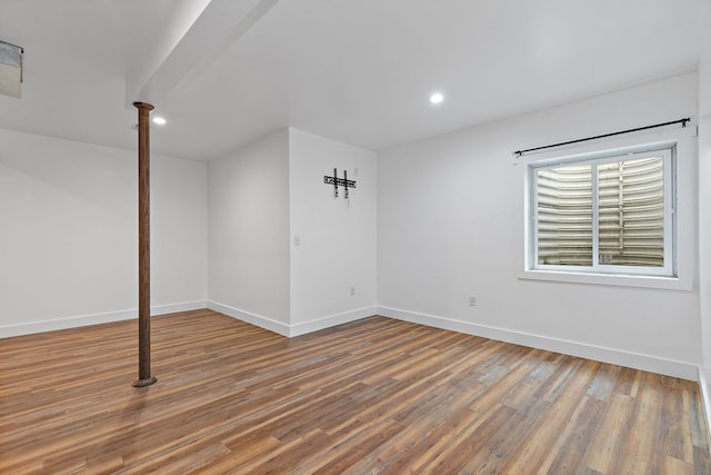 unfurnished room with wood-type flooring