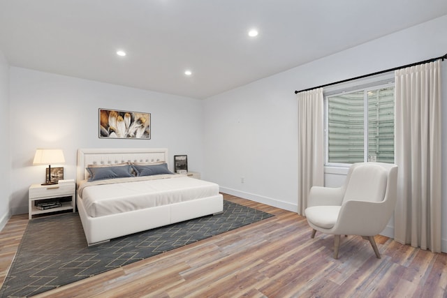 bedroom with hardwood / wood-style flooring