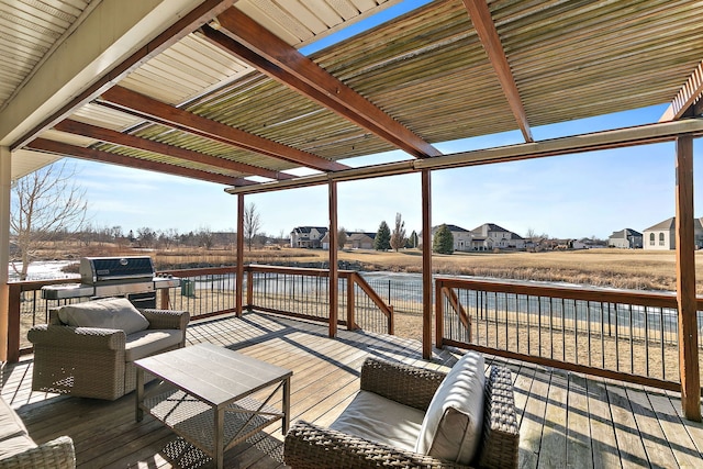 wooden deck featuring a water view, an outdoor living space, and a pergola