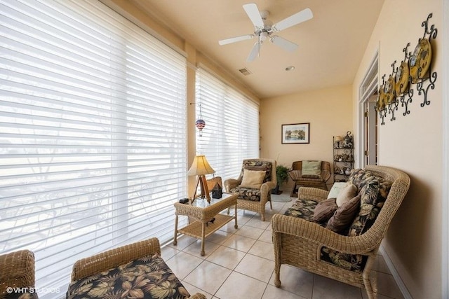 sunroom with ceiling fan