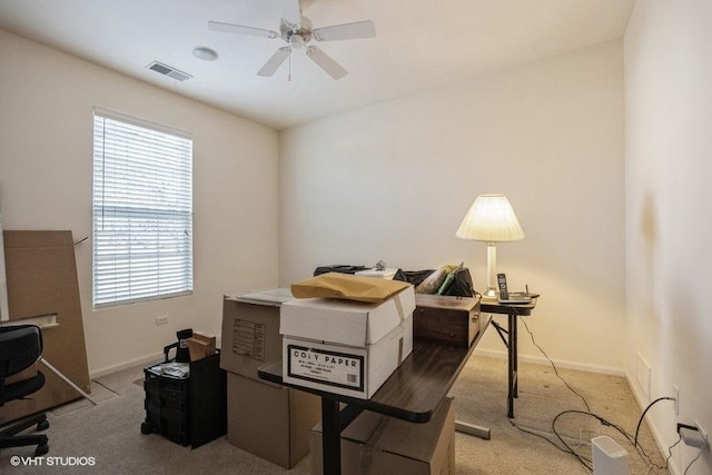 office with light colored carpet and ceiling fan