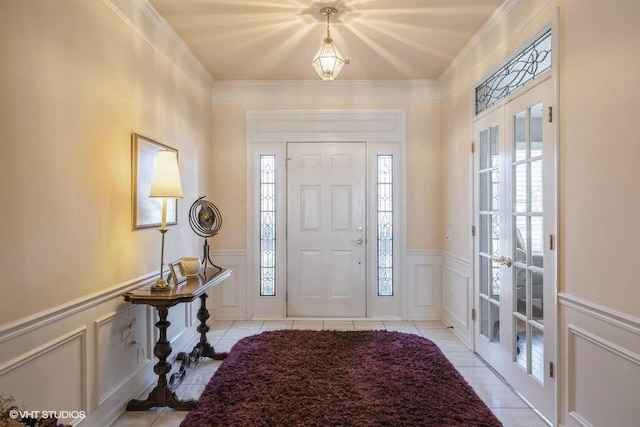 tiled entryway featuring french doors