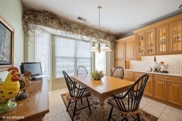 dining area featuring light tile patterned floors