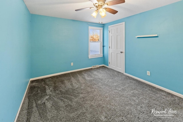 unfurnished room featuring ceiling fan and carpet floors