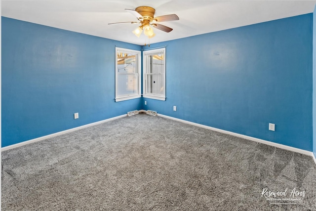 unfurnished room with ceiling fan and carpet floors