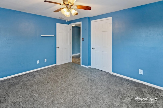 unfurnished bedroom featuring ceiling fan and carpet