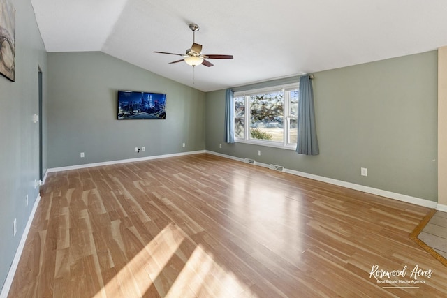 interior space with lofted ceiling, ceiling fan, and light hardwood / wood-style flooring