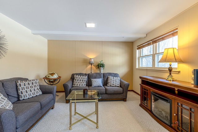 living room with carpet floors and beam ceiling