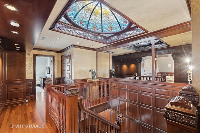 915 N Dearborn St, Chicago, IL 60610 - interior space featuring an upstairs landing, crown molding, a wainscoted wall, a decorative wall, and wood finished floors