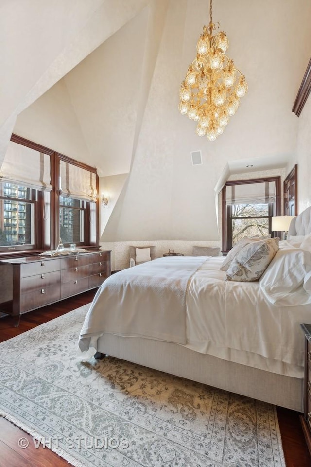 915 N Dearborn St, Chicago, IL 60610 - bedroom with dark wood-type flooring, a chandelier, and high vaulted ceiling