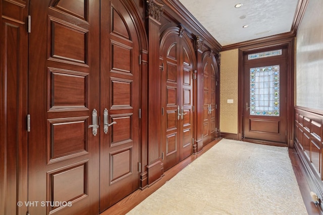 915 N Dearborn St, Chicago, IL 60610 - foyer with wood finished floors, ornamental molding, and recessed lighting
