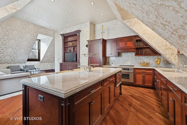 915 N Dearborn St, Chicago, IL 60610 - kitchen featuring a sink, open shelves, dark wood-style floors, and oven