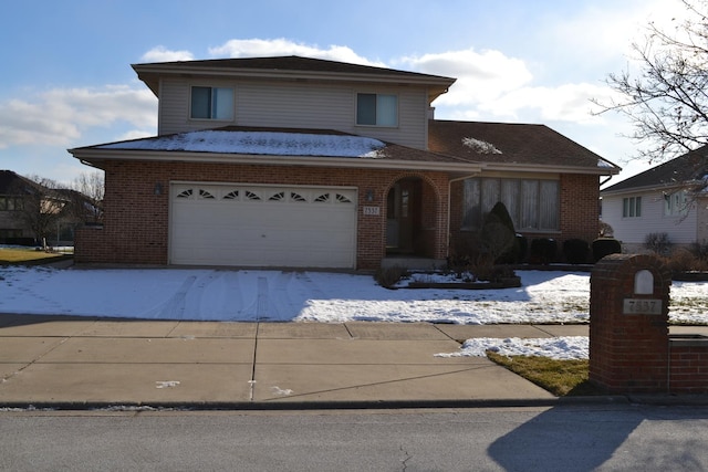 view of front of property with concrete driveway and brick siding