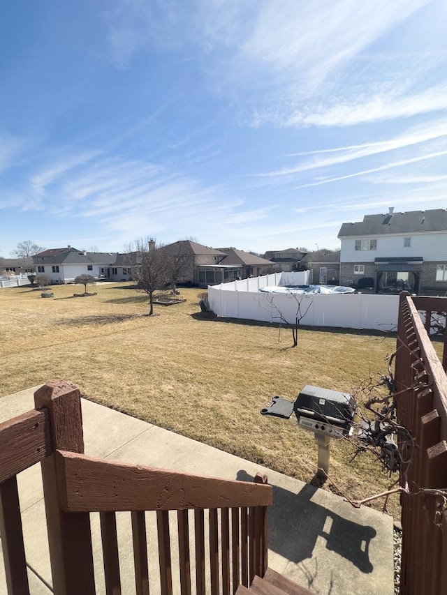 view of yard with a residential view and fence