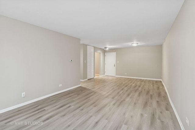 unfurnished room with light hardwood / wood-style flooring