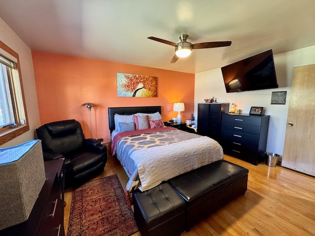 bedroom with ceiling fan and light hardwood / wood-style flooring