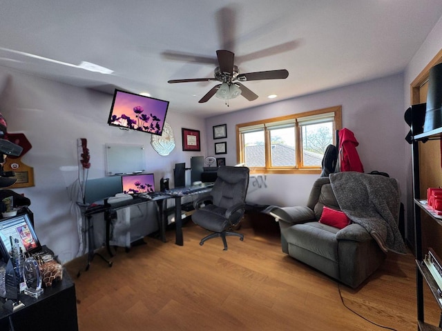 home office featuring ceiling fan and light hardwood / wood-style floors