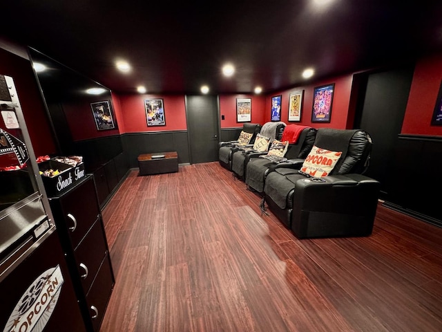 cinema room with dark wood-type flooring