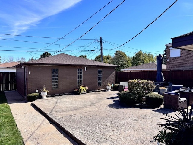 view of side of home with a patio